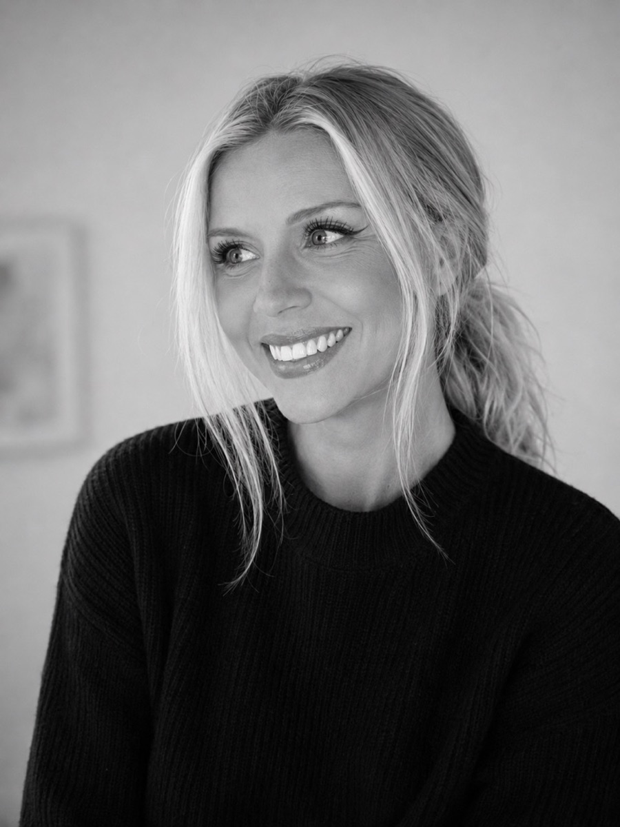 Michelle, AI builder and creative developer, in a black-and-white editorial portrait.